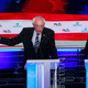 Sen. Kamala Harris (D-Calif.) and former Vice President Joe Biden flank Sen. Bernie Sanders (I-Vt.), during the second night of the Democratic presidential primary debate June 27, 2019, in Miami.